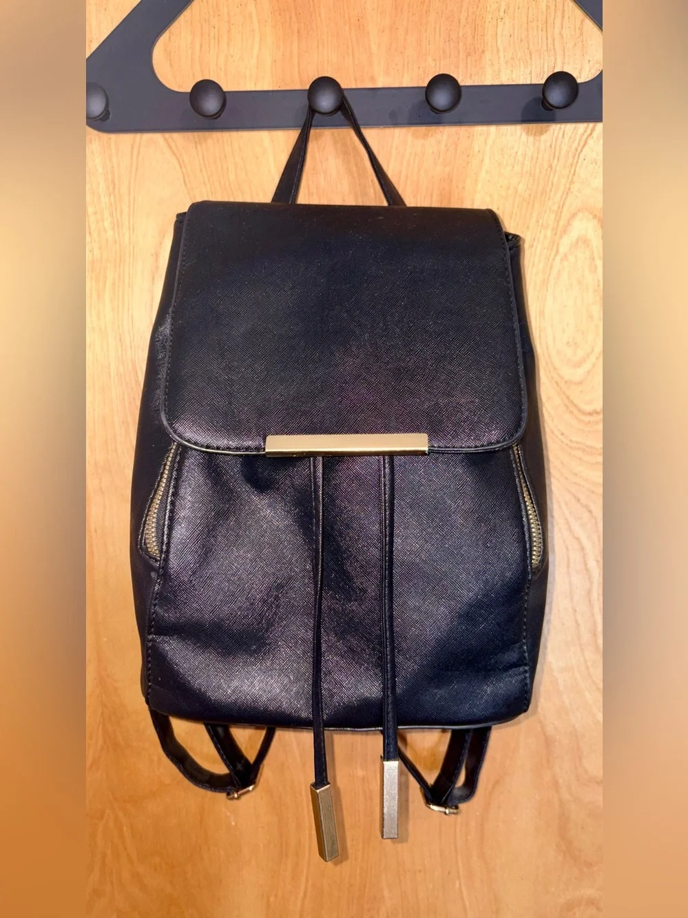Black faux leather with gold detailing